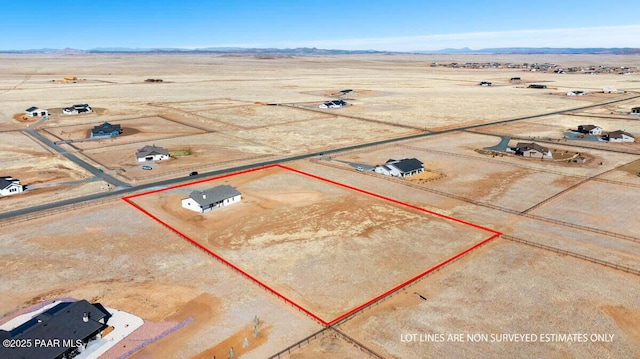 bird's eye view with a mountain view, a desert view, and a rural view