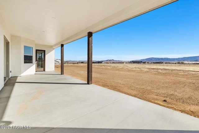 view of patio / terrace featuring a mountain view