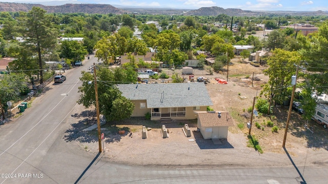 birds eye view of property featuring a mountain view