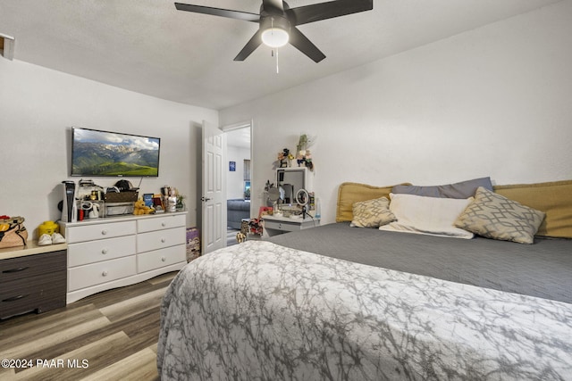 bedroom featuring ceiling fan and light wood-type flooring