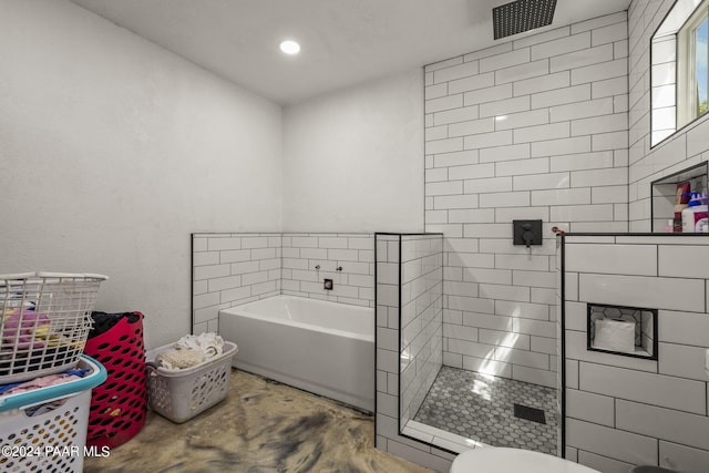 bathroom featuring separate shower and tub, toilet, and concrete flooring