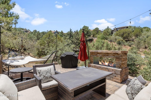 965 Northwood Loop, Prescott, AZ 86303 - view of patio featuring an outdoor stone fireplace and grilling area