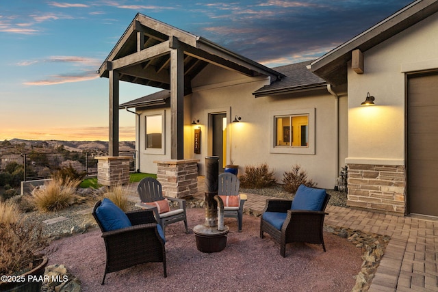 view of patio terrace at dusk