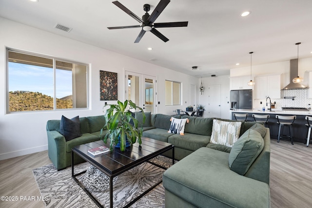 1232 Jordin Dr, Prescott, AZ 86303 - living room featuring ceiling fan, sink, and light wood-type flooring