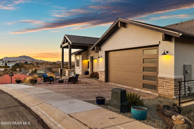 view of front facade with a mountain view and a garage