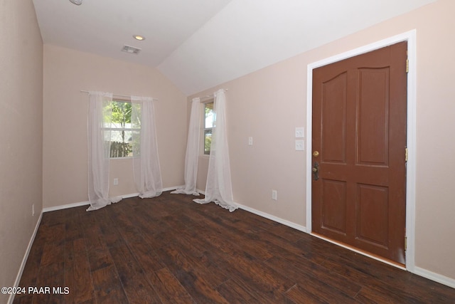 interior space featuring dark hardwood / wood-style floors and vaulted ceiling