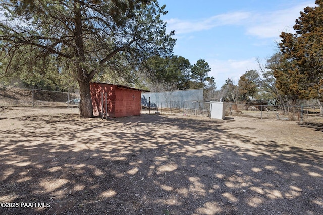 view of shed with fence
