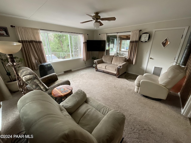 living room with ceiling fan and carpet floors