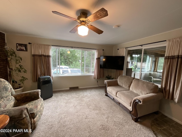 living room featuring carpet and ceiling fan