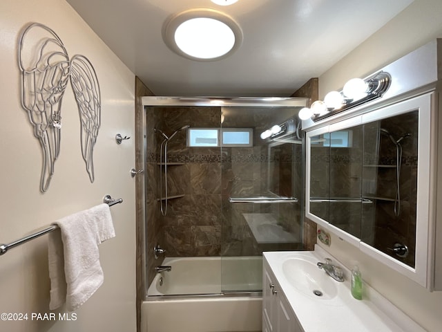 bathroom with vanity and enclosed tub / shower combo