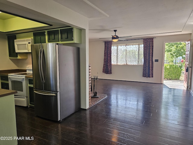 3916 N Catherine Dr, Prescott Valley, AZ 86314 - kitchen with white appliances, green cabinets, dark wood-style floors, a ceiling fan, and dark countertops