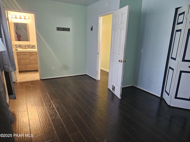 3916 N Catherine Dr, Prescott Valley, AZ 86314 - unfurnished bedroom with dark wood-type flooring and ensuite bathroom