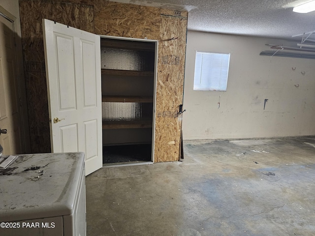3916 N Catherine Dr, Prescott Valley, AZ 86314 - interior space featuring unfinished concrete floors, a textured ceiling, and washer / dryer