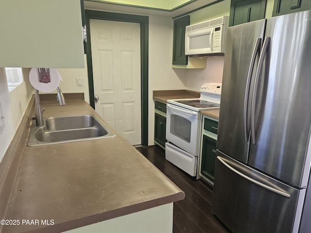 3916 N Catherine Dr, Prescott Valley, AZ 86314 - kitchen with white appliances, green cabinetry, and dark wood-style flooring