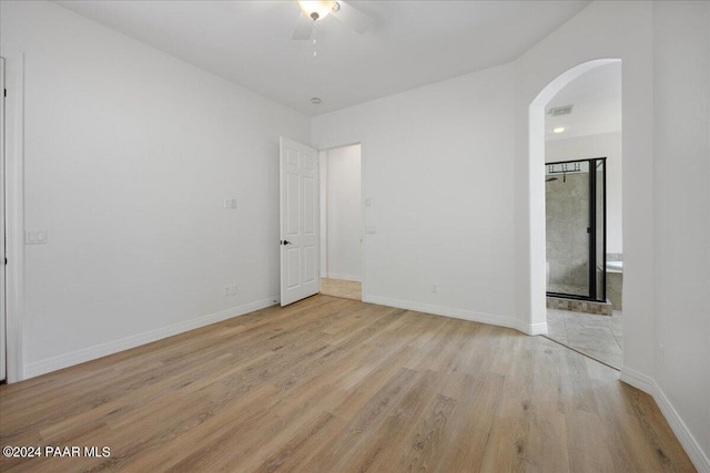 unfurnished room featuring ceiling fan and light wood-type flooring