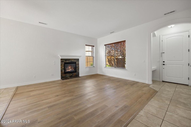 unfurnished living room featuring light hardwood / wood-style floors