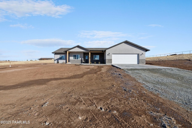 ranch-style home featuring a garage