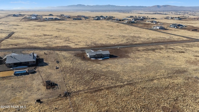 aerial view featuring a mountain view and a rural view