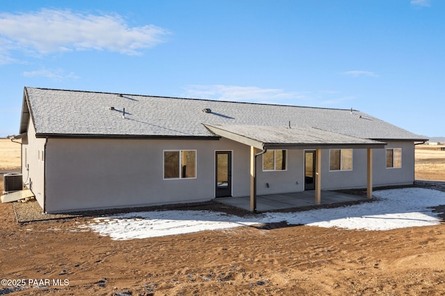 back of house featuring central AC and a patio area