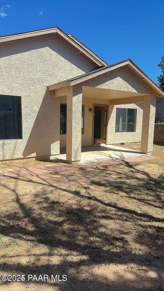 back of house with a patio