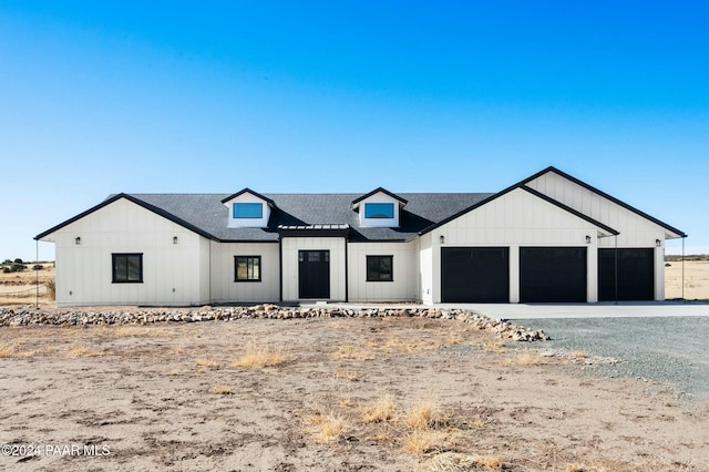 modern farmhouse style home featuring a garage