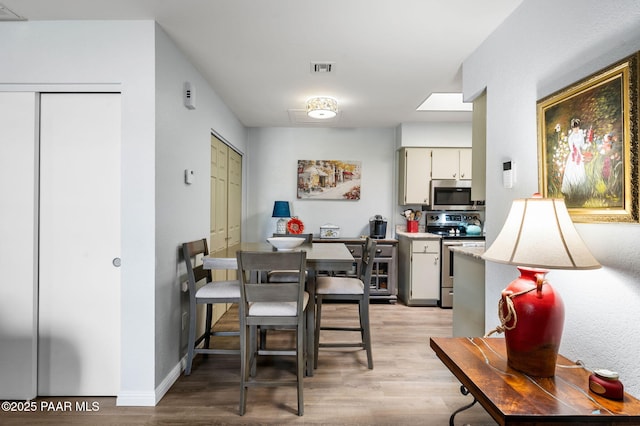 3168 Dome Rock Pl Unit 16F, Prescott, AZ 86301 - dining area with light wood-style floors