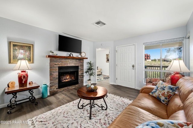 3168 Dome Rock Pl Unit 16F, Prescott, AZ 86301 - living area featuring wood finished floors and a stone fireplace