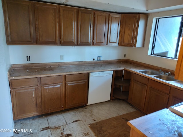 kitchen featuring dishwasher and sink