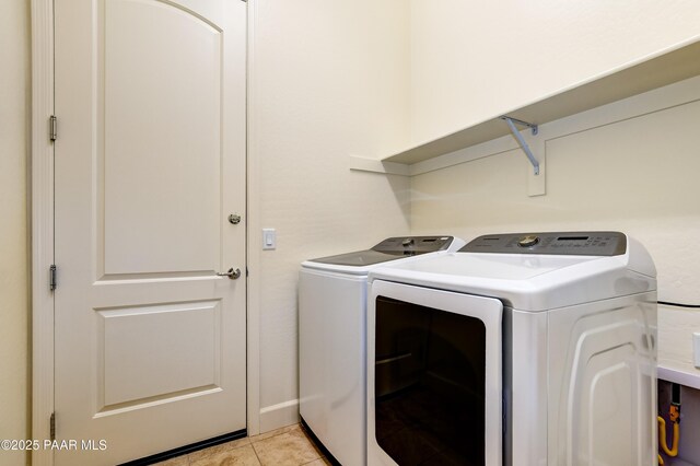 8773 N Auster Ln, Prescott Valley, AZ 86315 - laundry area with separate washer and dryer and light tile patterned floors