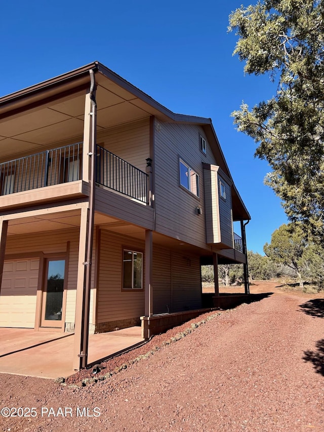 view of property exterior with a balcony