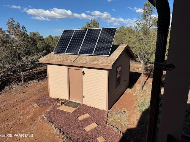 view of outbuilding with solar panels