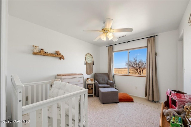 1250 Pronghorn Trl, Chino Valley, AZ 86323 - bedroom with a nursery area, carpet, baseboards, visible vents, and a ceiling fan