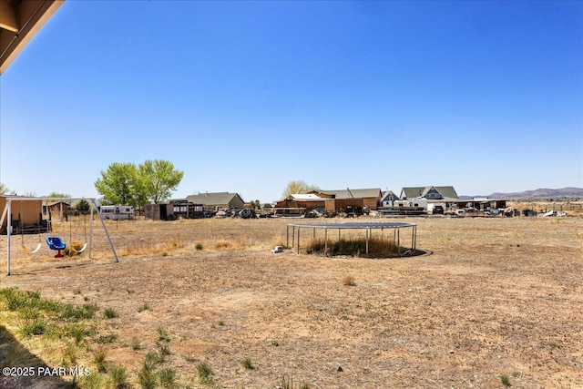 1250 Pronghorn Trl, Chino Valley, AZ 86323 - view of yard with a mountain view and a trampoline