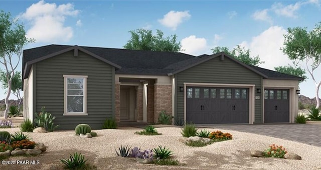 single story home featuring brick siding, a garage, and driveway