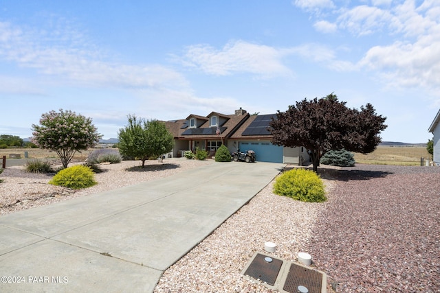 view of front of home featuring solar panels