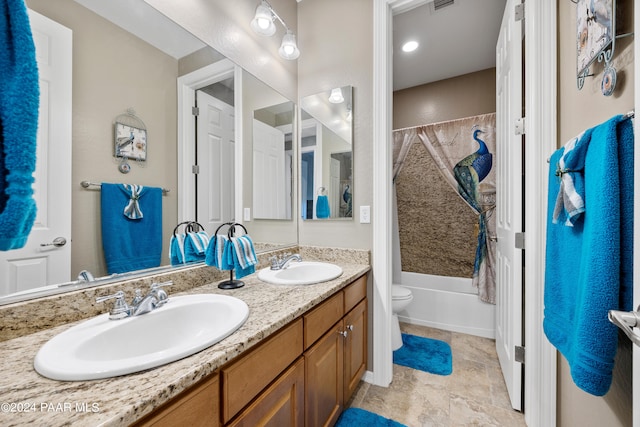 full bathroom with vanity, toilet, and shower / tub combo