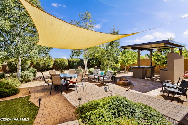 view of patio / terrace featuring a fire pit