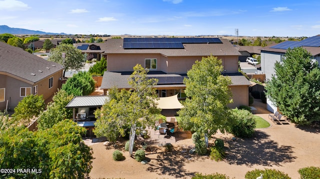 birds eye view of property with a mountain view