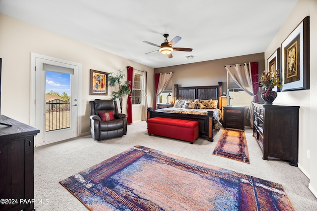 carpeted bedroom featuring ceiling fan and access to outside