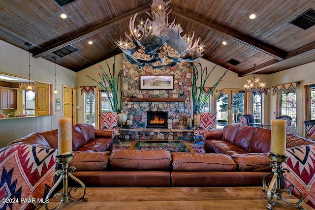 living room with an inviting chandelier, a stone fireplace, high vaulted ceiling, and beamed ceiling