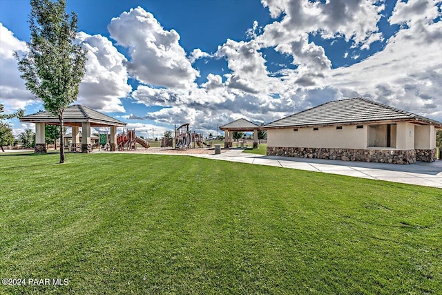 view of yard with a playground and a gazebo