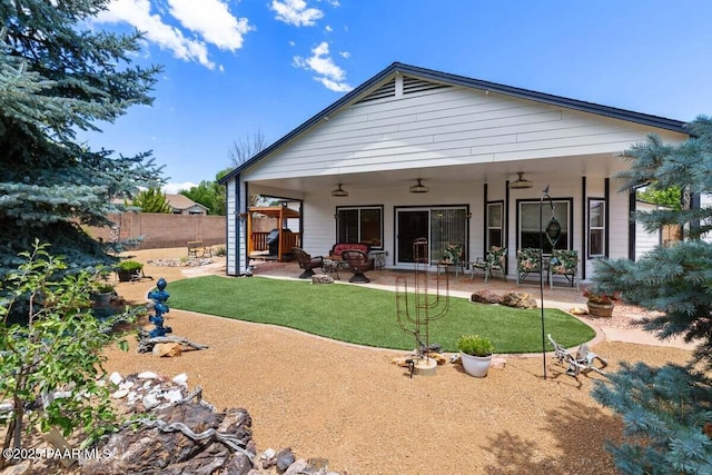 7605 E Circle Wagons Way, Prescott Valley, AZ 86315 - back of property with a patio and a ceiling fan