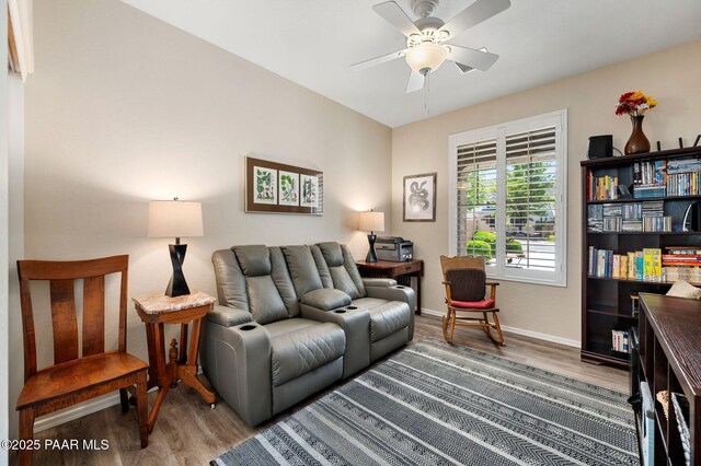 7334 E Goodnight Ln, Prescott Valley, AZ 86314 - living room with wood finished floors, a ceiling fan, and baseboards