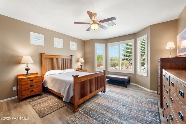 7334 E Goodnight Ln, Prescott Valley, AZ 86314 - bedroom featuring baseboards, light wood-style floors, and a ceiling fan