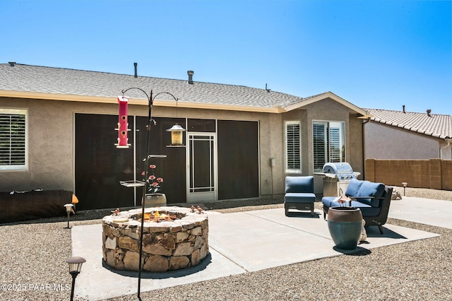 7334 E Goodnight Ln, Prescott Valley, AZ 86314 - rear view of property with a fire pit, stucco siding, and a patio area