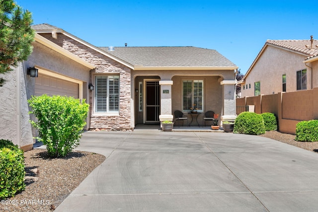 7334 E Goodnight Ln, Prescott Valley, AZ 86314 - ranch-style house with an attached garage, stucco siding, driveway, and stone siding