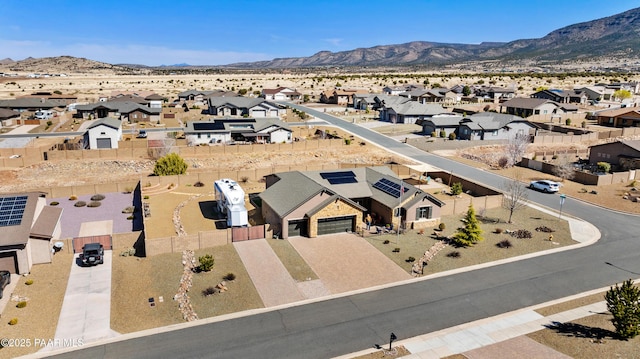 birds eye view of property with a mountain view and a residential view