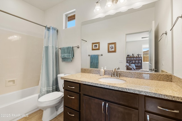 ensuite bathroom with connected bathroom, toilet, vanity, shower / tub combo with curtain, and tile patterned flooring