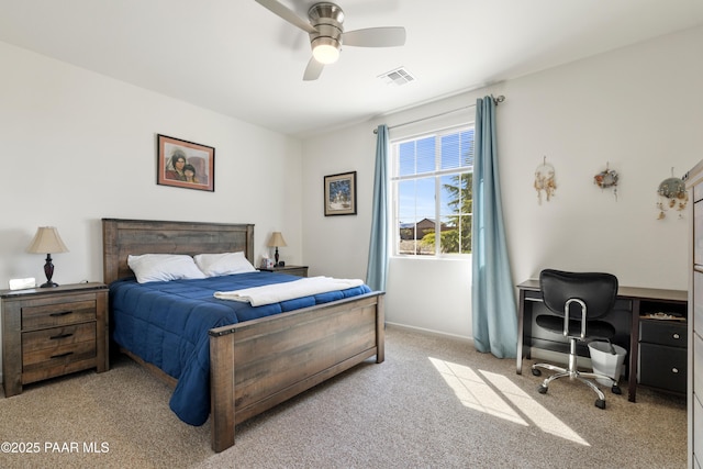 carpeted bedroom featuring baseboards, visible vents, and a ceiling fan