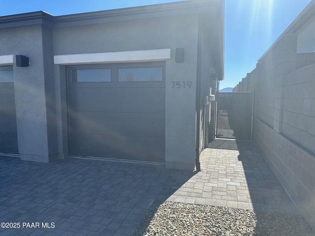 garage featuring fence